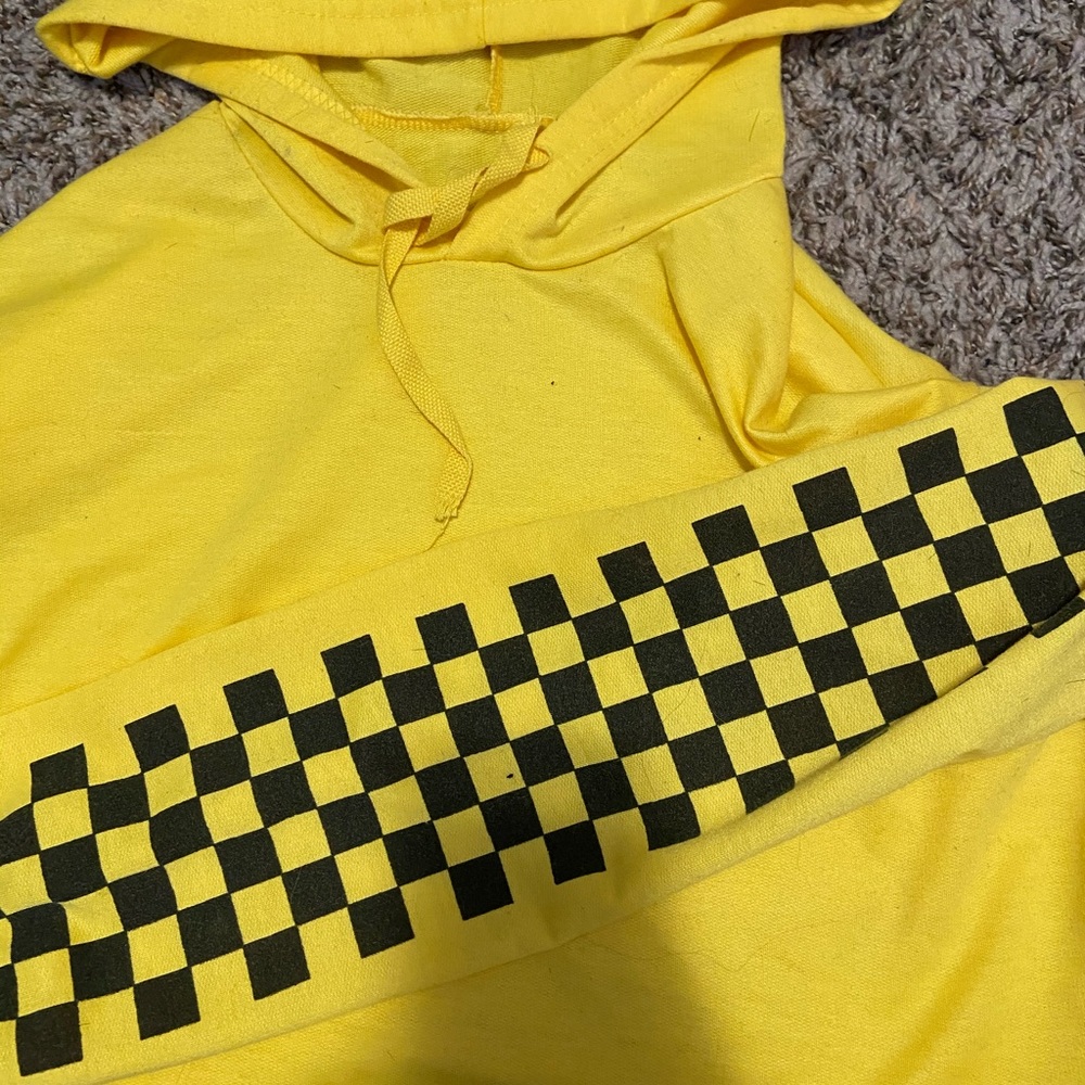 Yellow cropped top with checkers on the arms